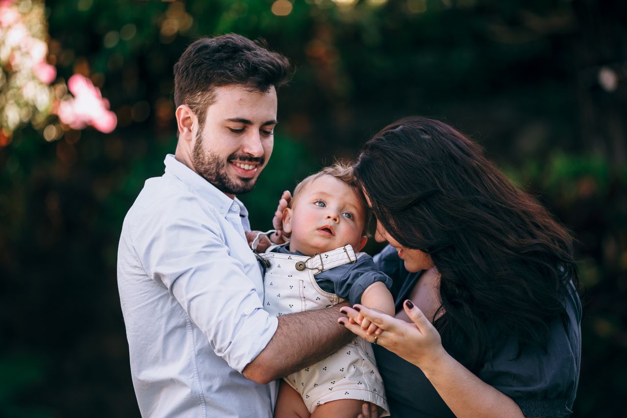 A joyful family enjoying a sunny day outdoors, capturing love and togetherness.